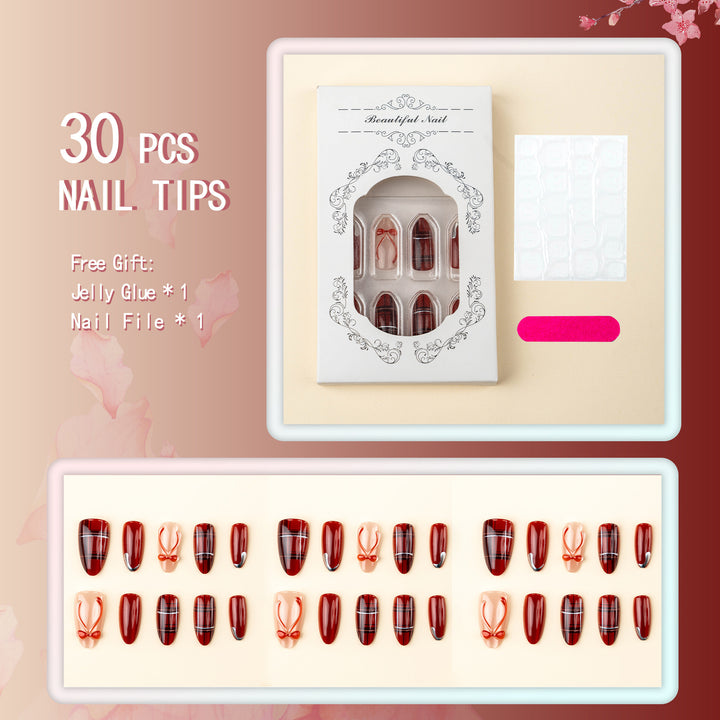 Art nail set with festive design and bow accents Bowlift
