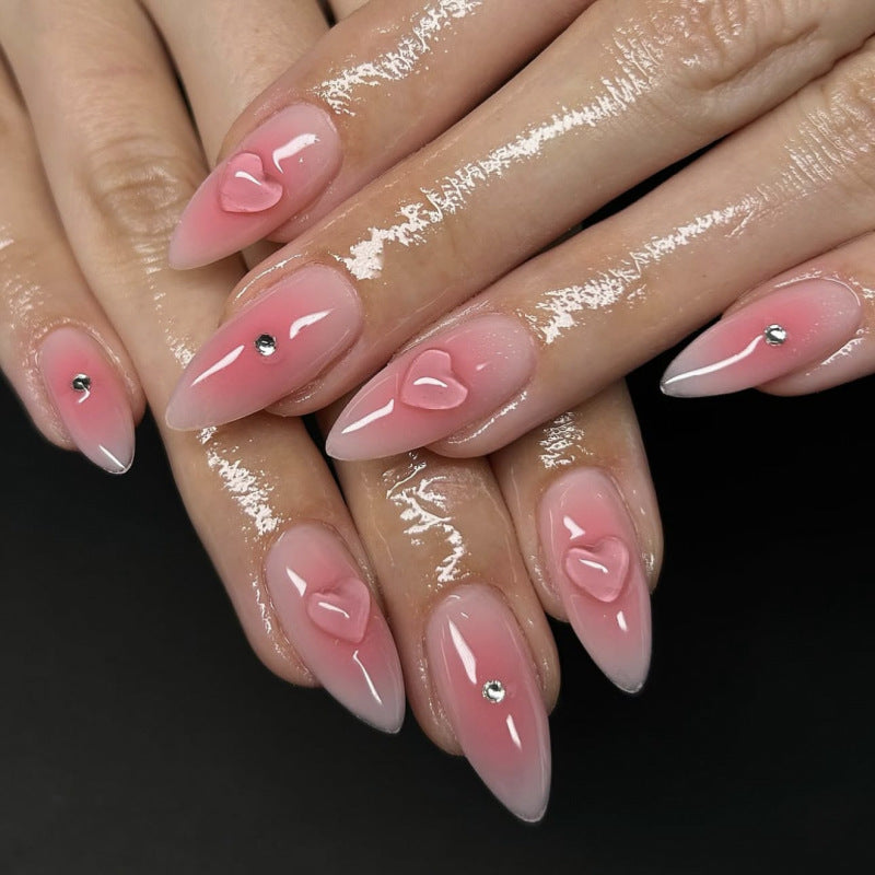 Artful stiletto nails with heart design and glitter accents Bowlift