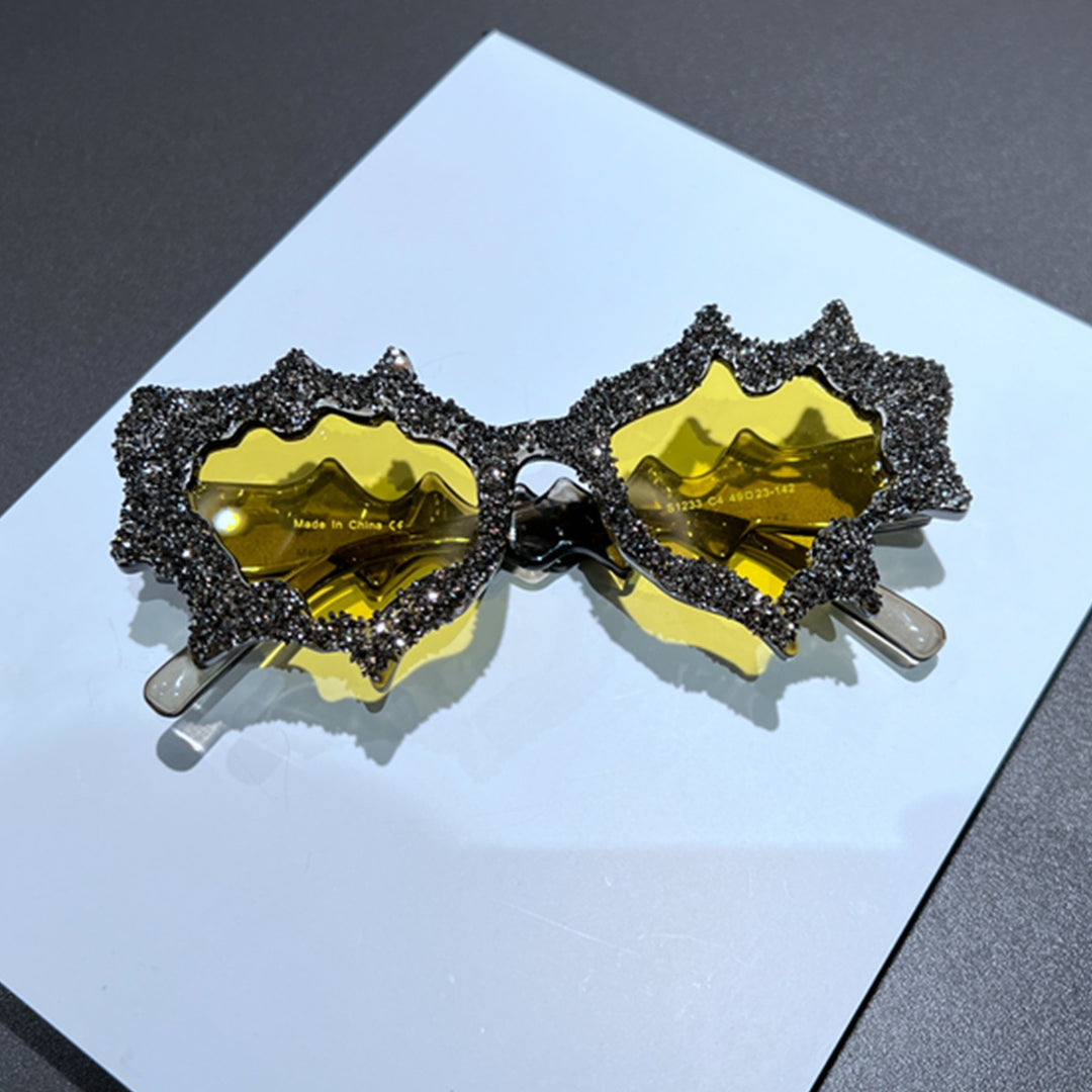 Ladies creative sunglasses in an extravagant design with glitter embellishments Bowlift