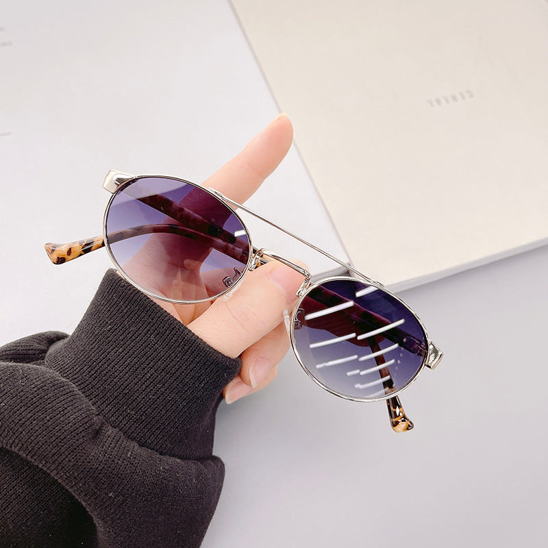 Ladies fashionable sunglasses in stylish round design with golden accents Bowlift