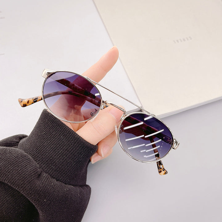 Ladies fashionable sunglasses in stylish round design with golden accents Bowlift