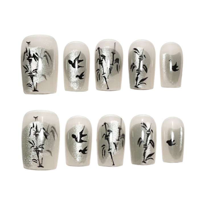 Handcrafted acrylic nails with decorative bird motifs Bowlift