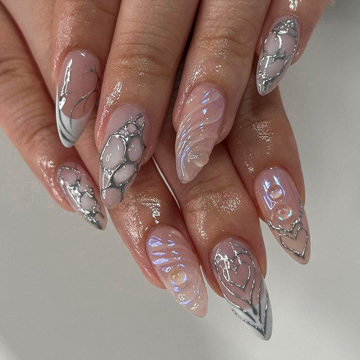 Artistic stiletto nails with holographic effects Bowlift