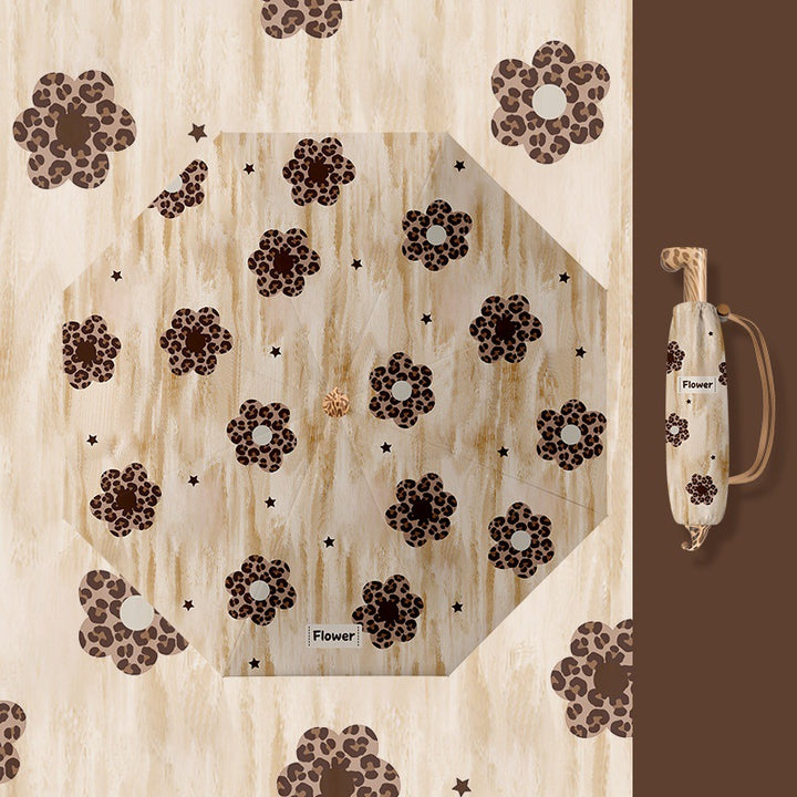 Ladies folding umbrella with playful design Bowlift