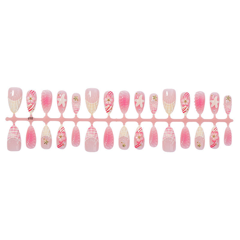 Artificial nail set with maritime shell and flower design Bowlift