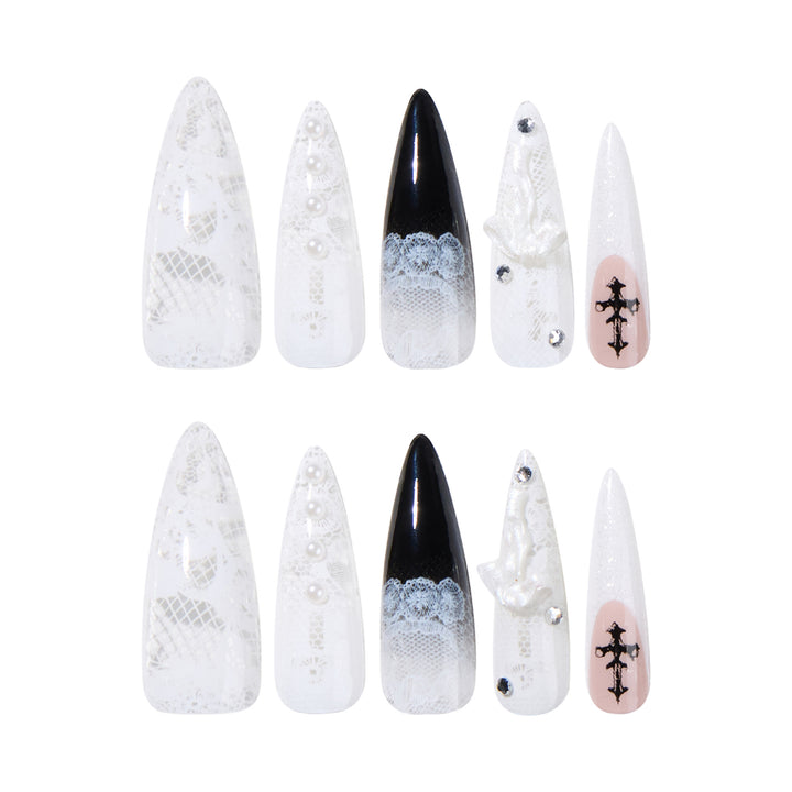 Artful stiletto nails with unique 3D elements and glitter accents Bowlift