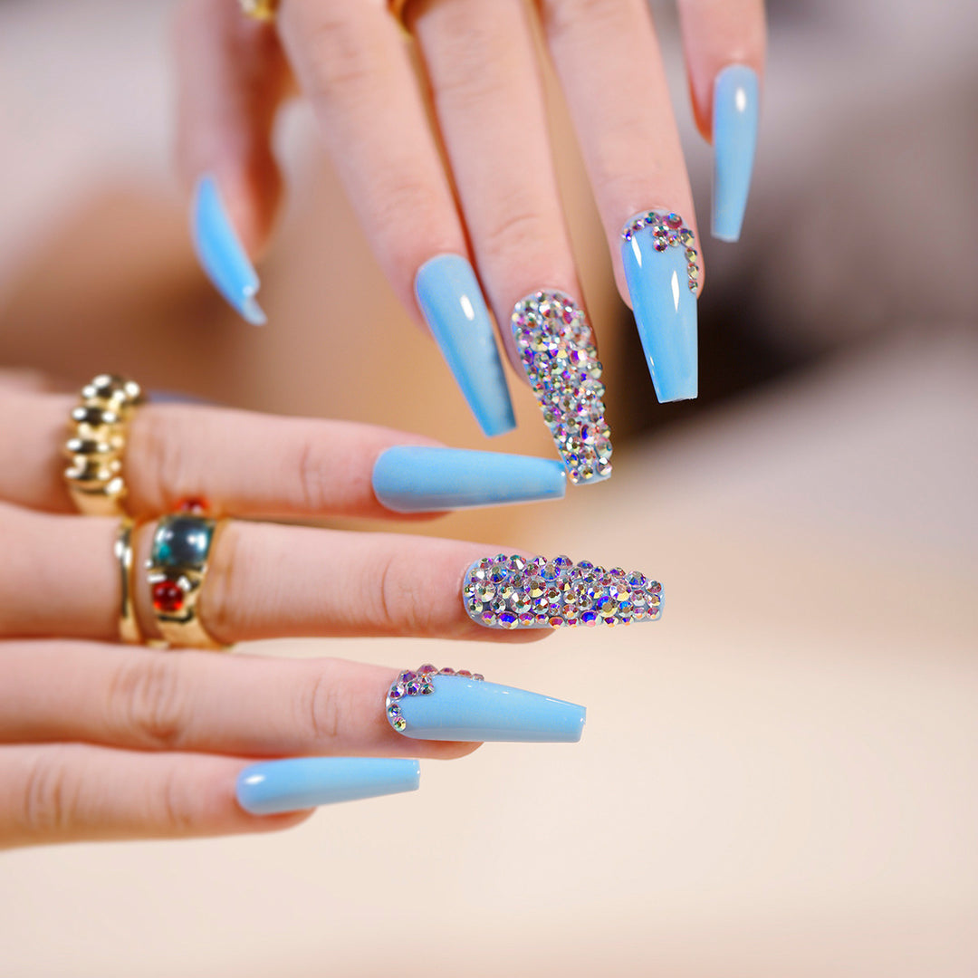 Artful Stiletto Nails with Radiant Rhinestone Accent Bowlift
