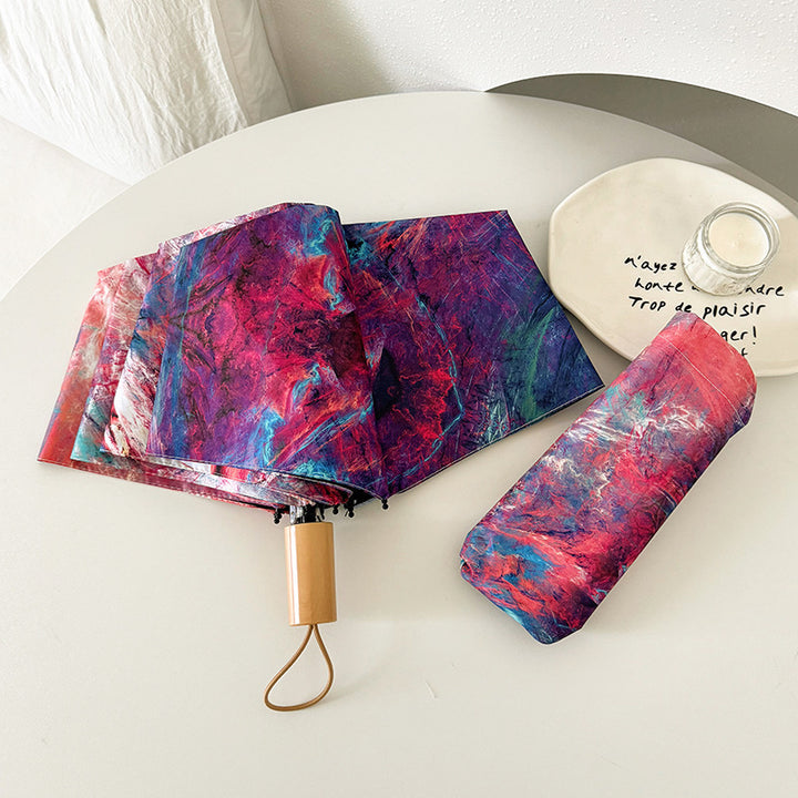 Ladies elegant folding umbrella with unique marble pattern Bowlift