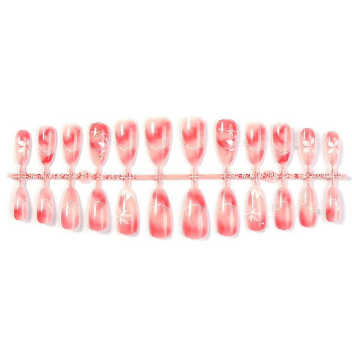 Acrylic nail set with elegant ombre design and floral accent Bowlift