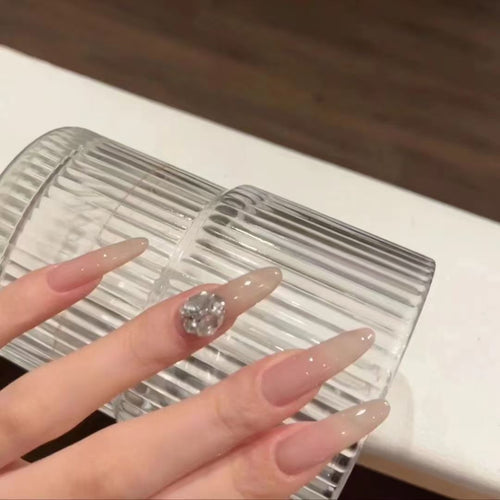 Elegant artificial nails with glitter and crystal accents Bowlift