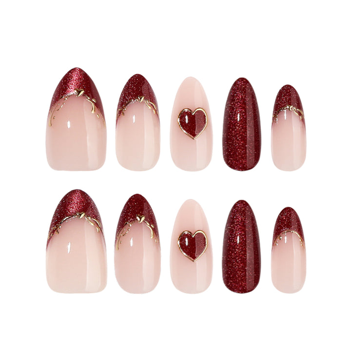 Artful stiletto nails with heart designs and glitter embellishment Bowlift