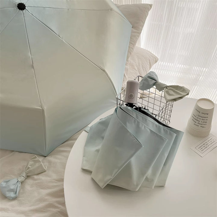 Women Folding Umbrella Bowlift