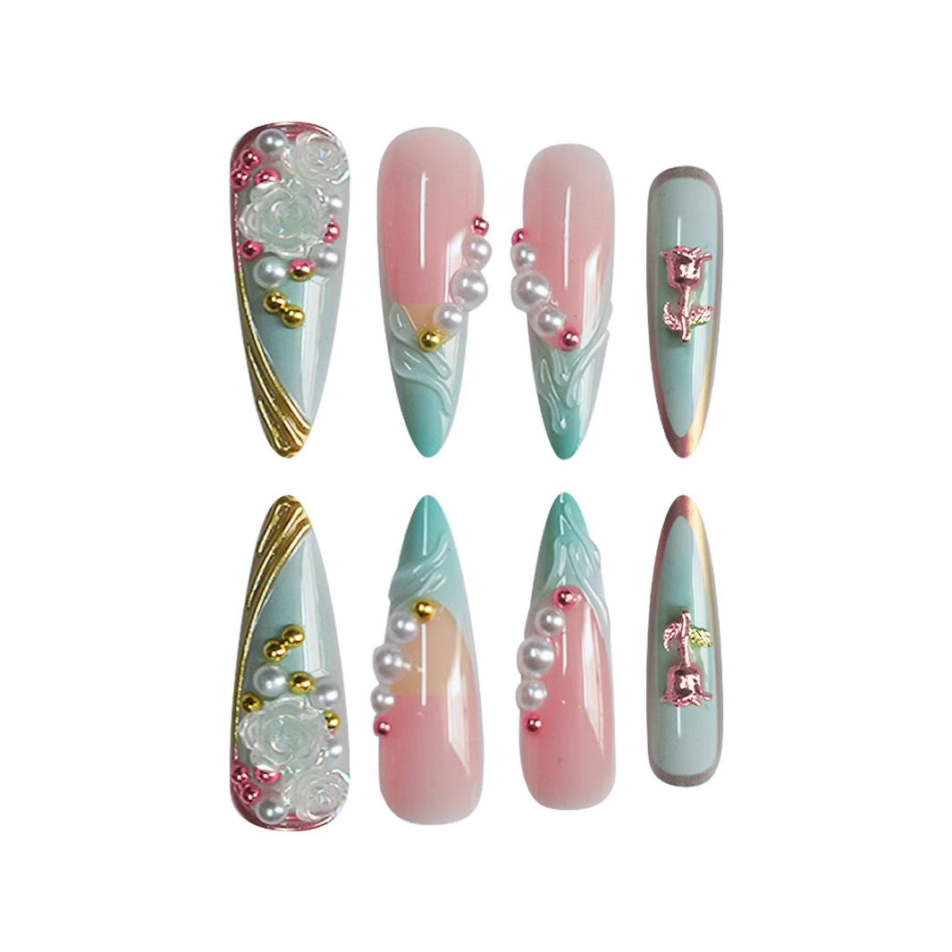 Luxurious Stiletto Nail Enhancements with Floral Accents Bowlift