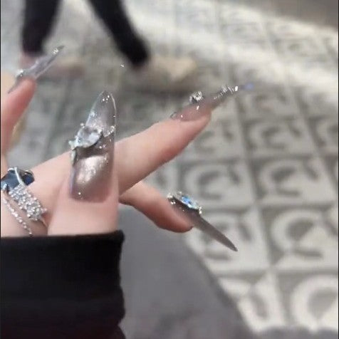 Glamorous artificial nails with rhinestone accents Bowlift