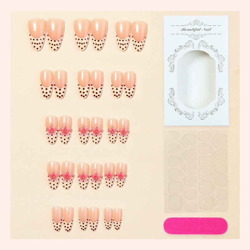 Acrylic nail set with romantic dots and floral accents Bowlift