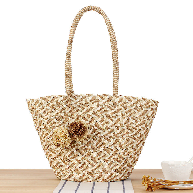 Fashionable basket bag with decorative pompons Bowlift