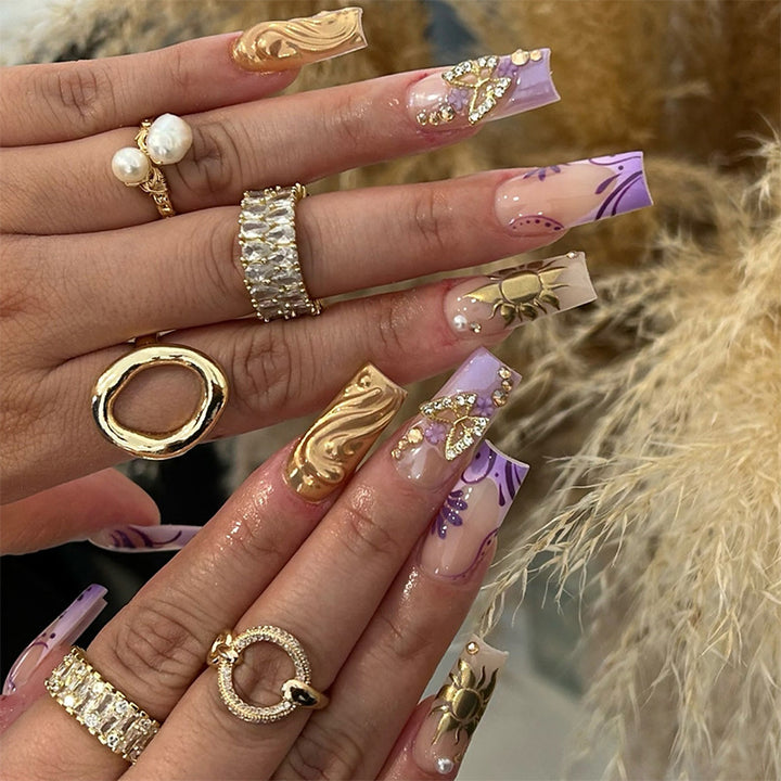Artificial nail set with delicate flower and glitter accents Bowlift