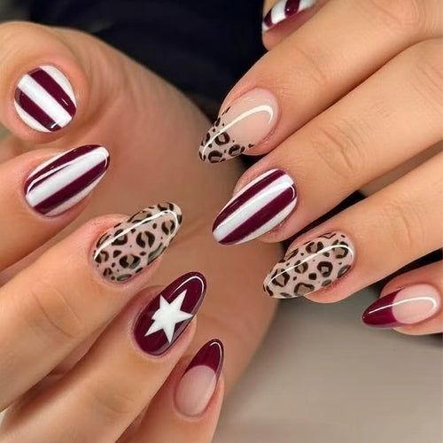 Artful stiletto nails with leopard pattern and elegant glitter decoration Bowlift