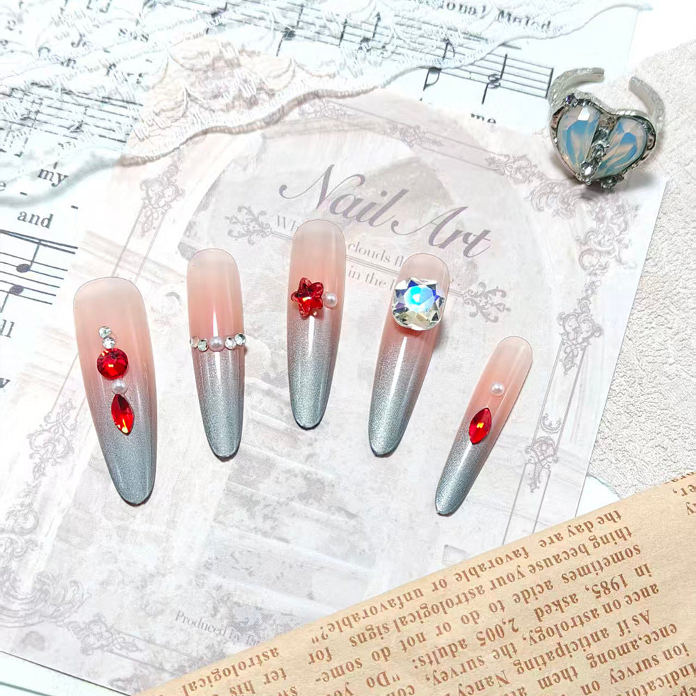 Glamorous artificial nails with rhinestones and embellishments Bowlift