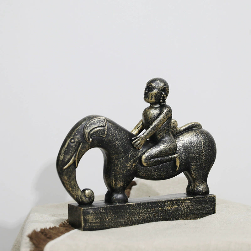 Whimsical Elephant and Child Sculpture