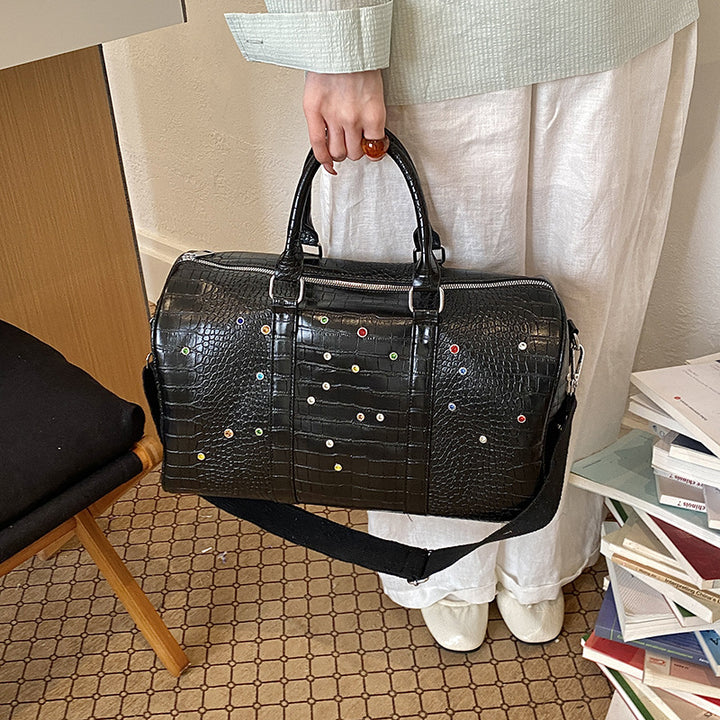 Fashionable travel bag with structured surface and versatile interior Bowlift