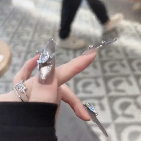 Glamorous artificial nails with rhinestone accents Bowlift