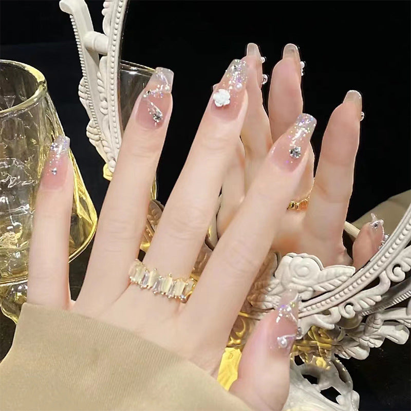 Artificial nails with heart design and glamorous accents Bowlift