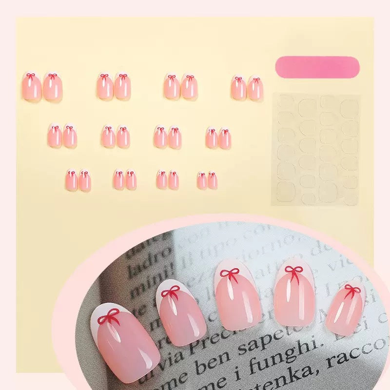 Artificial nail set with elegant bows and French tips Bowlift