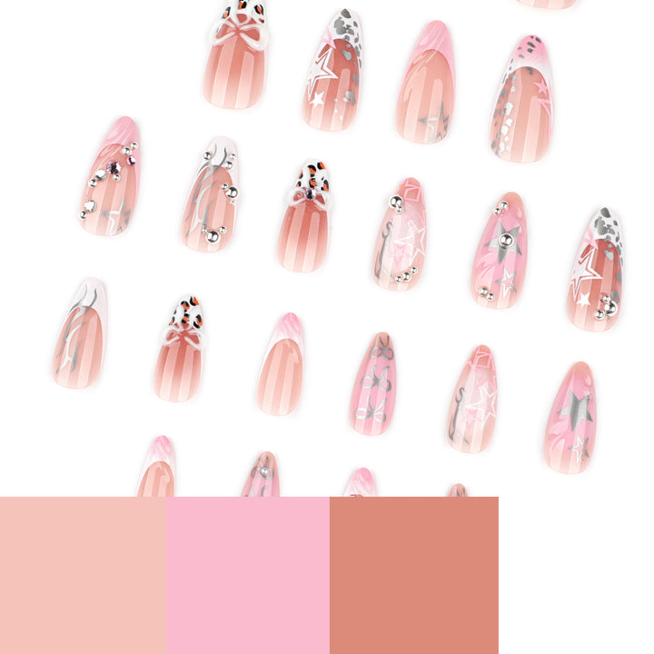 Artful stiletto nails with glitter and bow decorations Bowlift