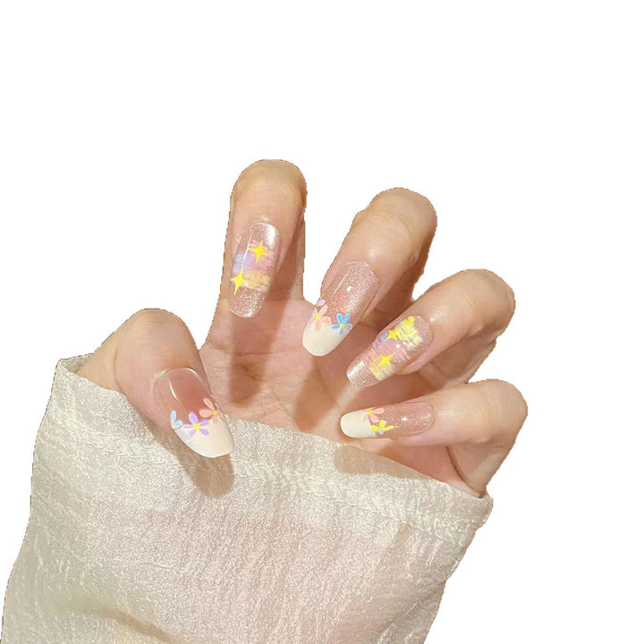 Artificial nails with delicate floral accents and glitter effects Bowlift