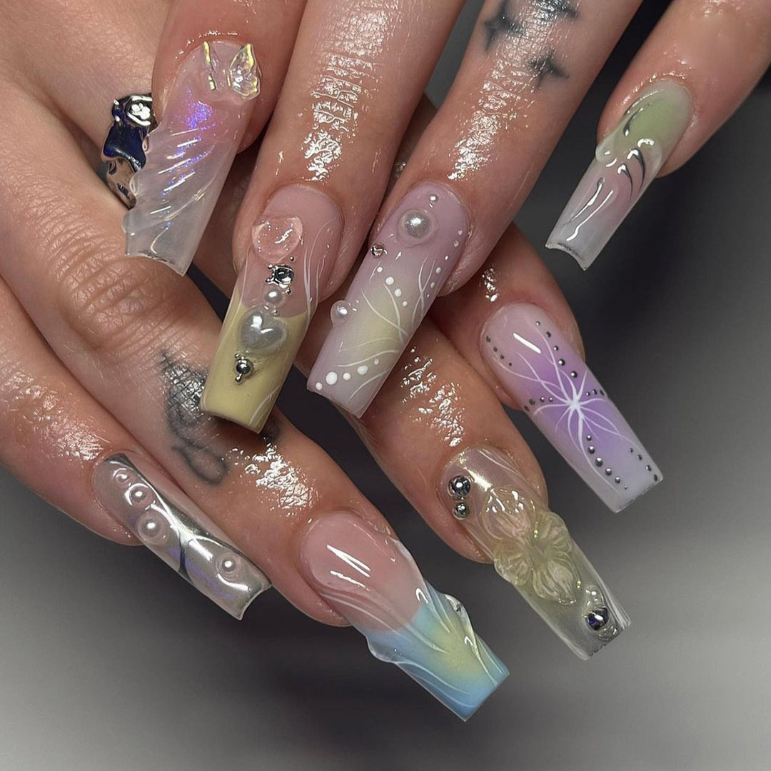Artful nail art with 3D details and glitter accents Bowlift