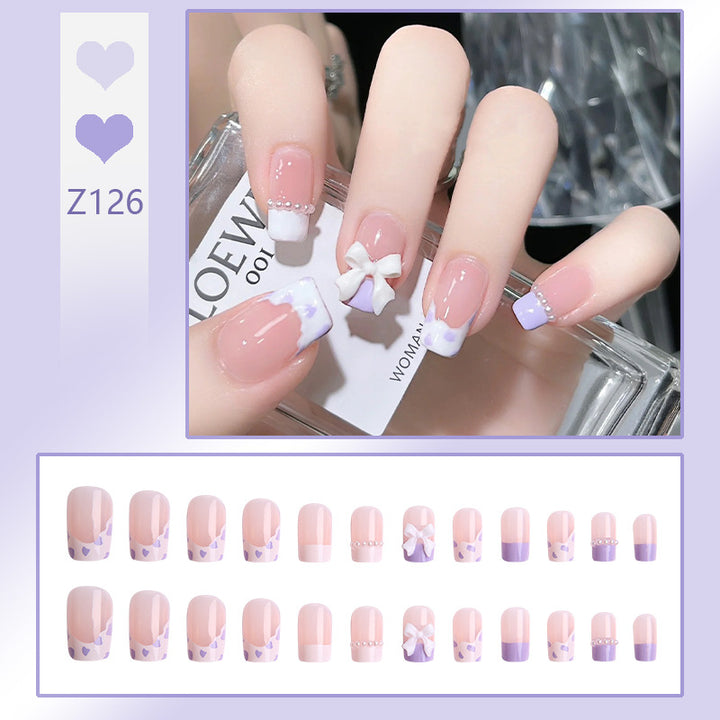 Nail art set with elegant wave patterns and delicate pearl accents Bowlift