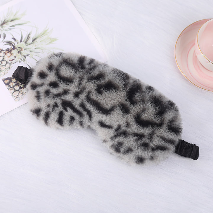 Women's cuddly faux fur sleep mask with heart-embossed surface and gathered comfort band Bowlift