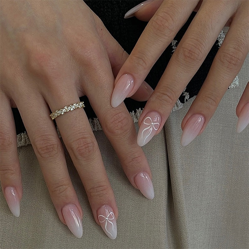 Artificial nail set with elegant designs and subtle accents Bowlift
