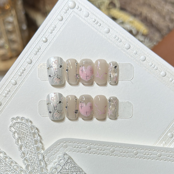 Decorative Press-On Nail Set with Heart and Silver Accents Bowlift