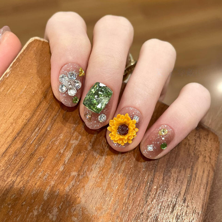Artificial nails with sparkling appliqués and floral designs Bowlift