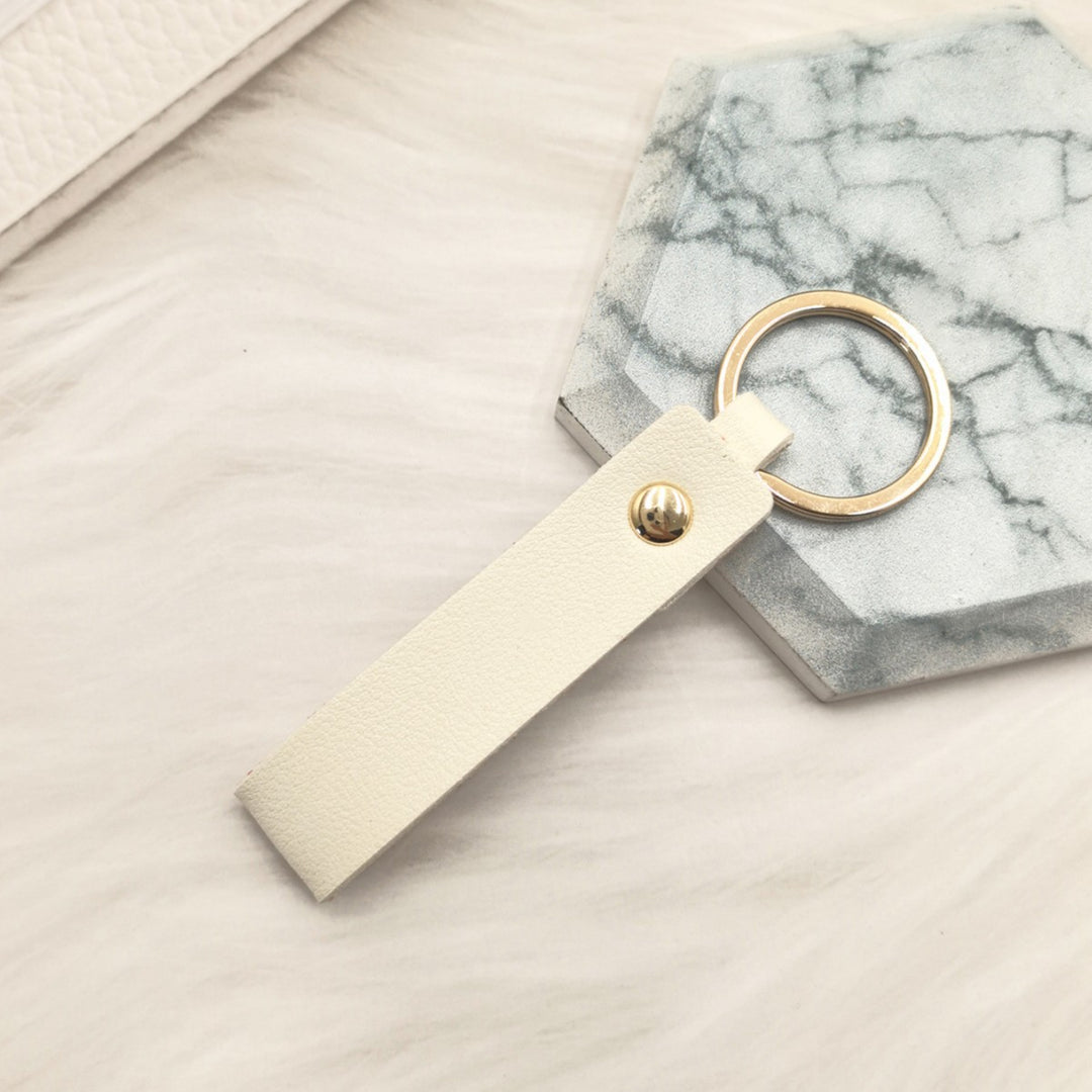 Unisex keychain made of high-quality synthetic leather with elegant metal embellishment Bowlift