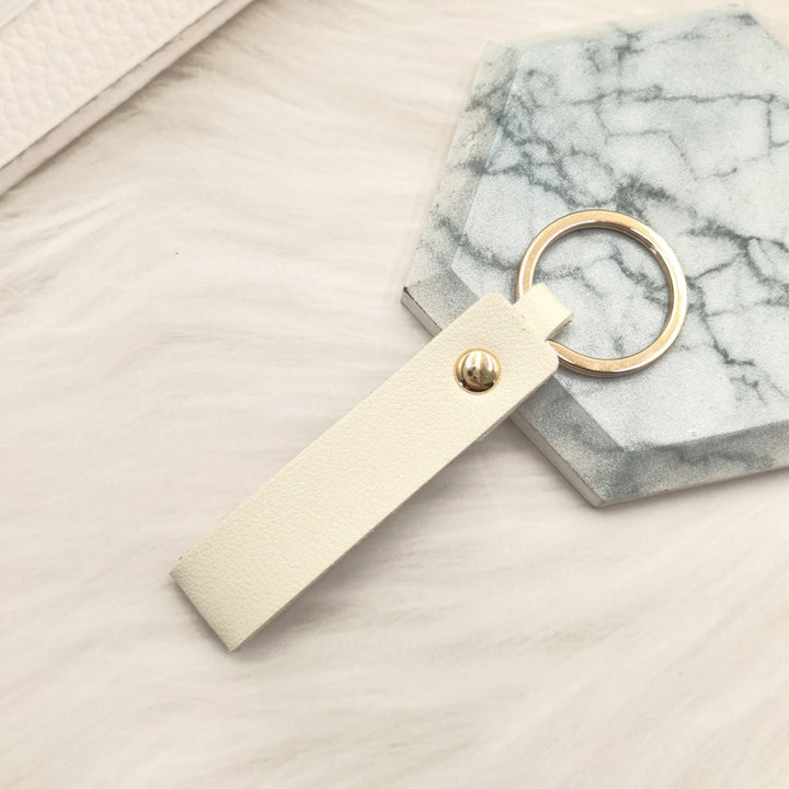 Unisex keychain made of high-quality synthetic leather with elegant metal embellishment Bowlift