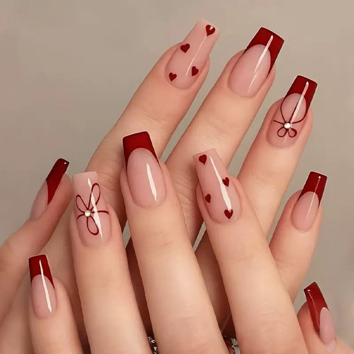 Artificial nail set with romantic heart and bow motifs Bowlift