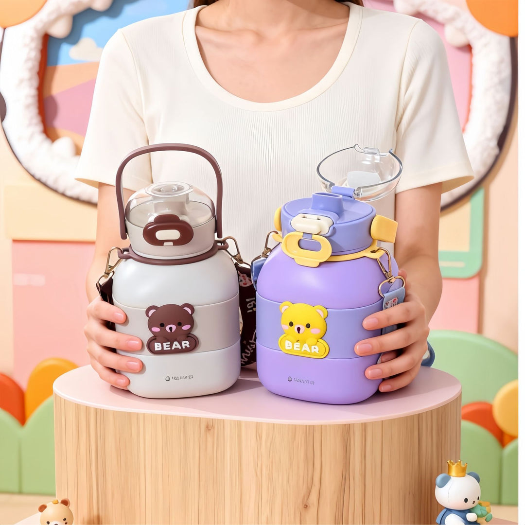 Child-friendly water bottle with carrying strap Bowlift