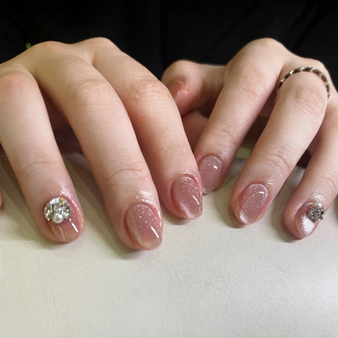 Artful glitter nail extensions with elegant rhinestone accents Bowlift