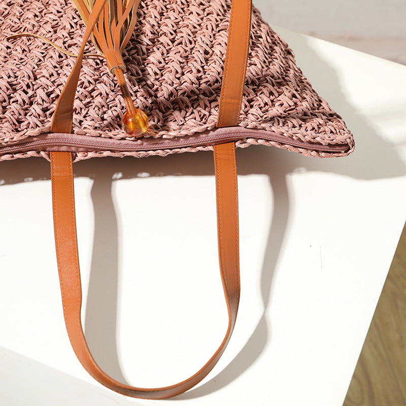 Handcrafted basket bag with fashionable tassel detail Bowlift