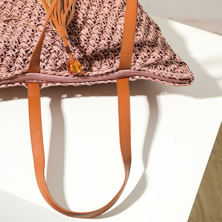 Handcrafted basket bag with fashionable tassel detail Bowlift
