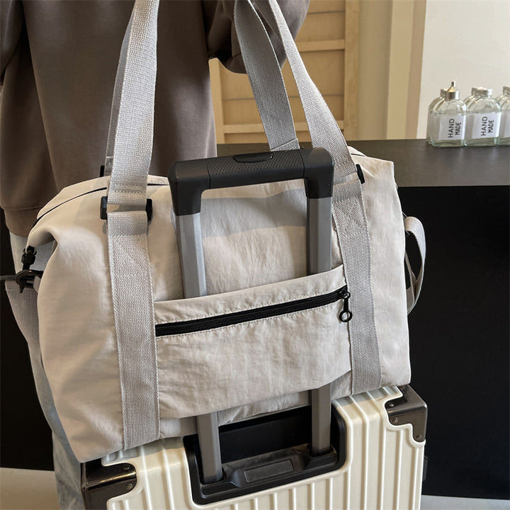 Sporty tote bag with multiple compartments and adjustable straps Bowlift