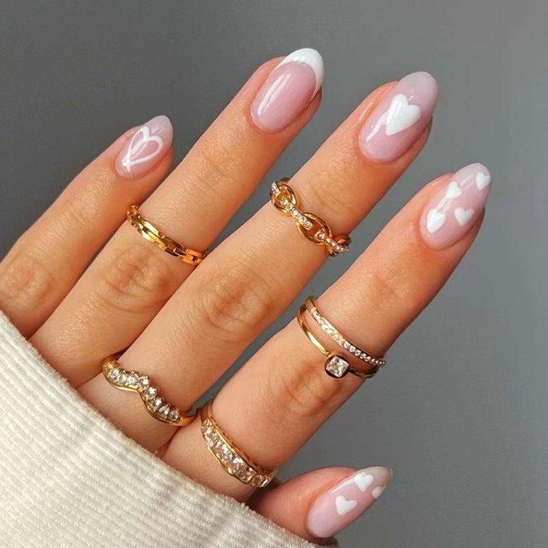 Elegant artificial nails with hearts and glitter Bowlift