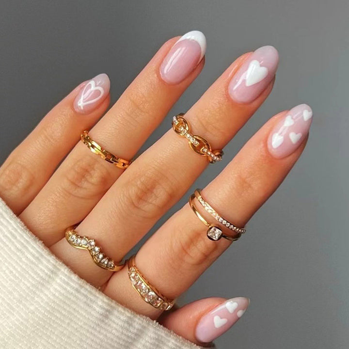 Elegant artificial nails with hearts and glitter Bowlift