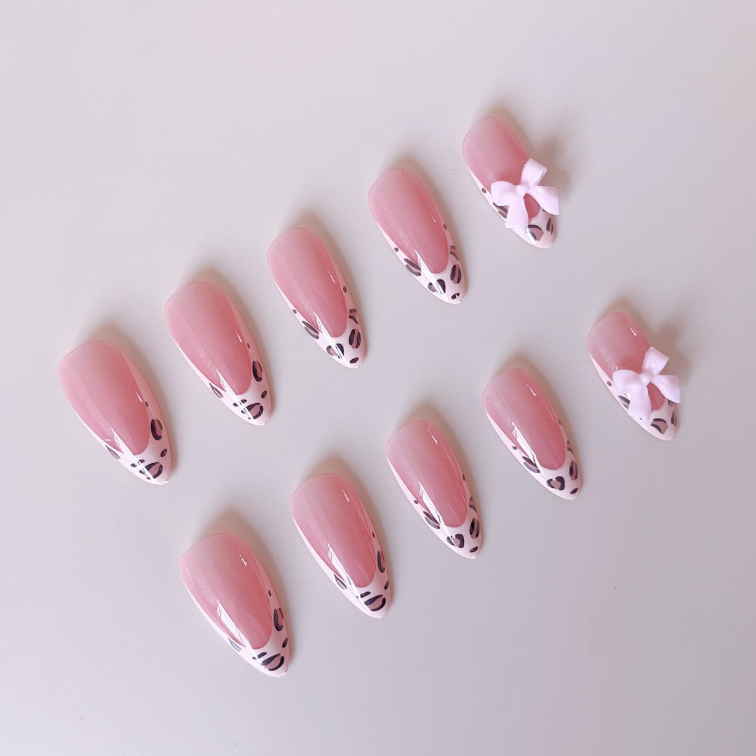 Acrylic nail set with leopard pattern and decorative bows Bowlift
