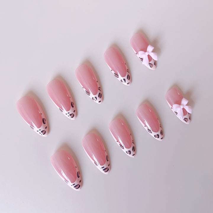 Acrylic nail set with leopard pattern and decorative bows Bowlift