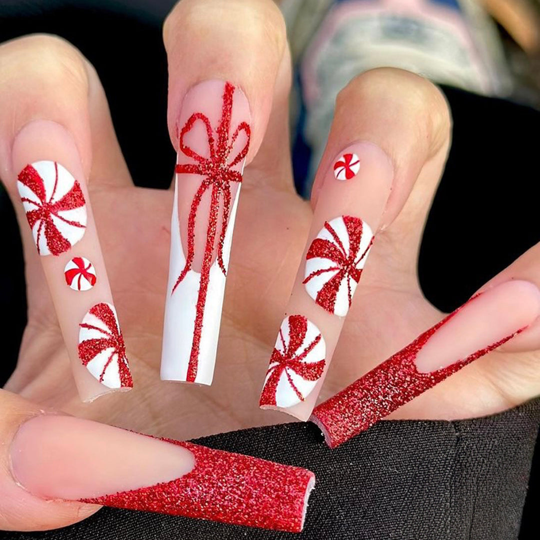 Artificial nail set with festive candy cane design and glitter accents Bowlift