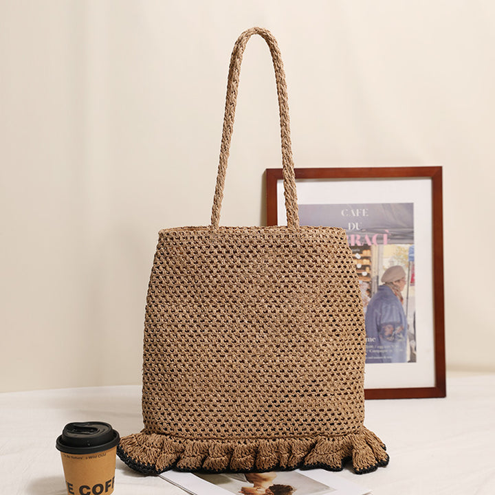 Handcrafted straw bag with fringed hem Bowlift